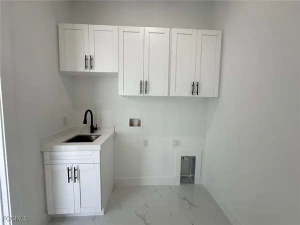 a view of cabinets with wooden floor