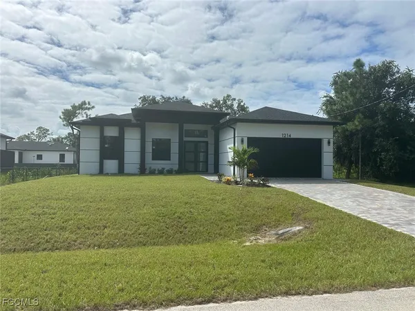 front view of a house with a yard