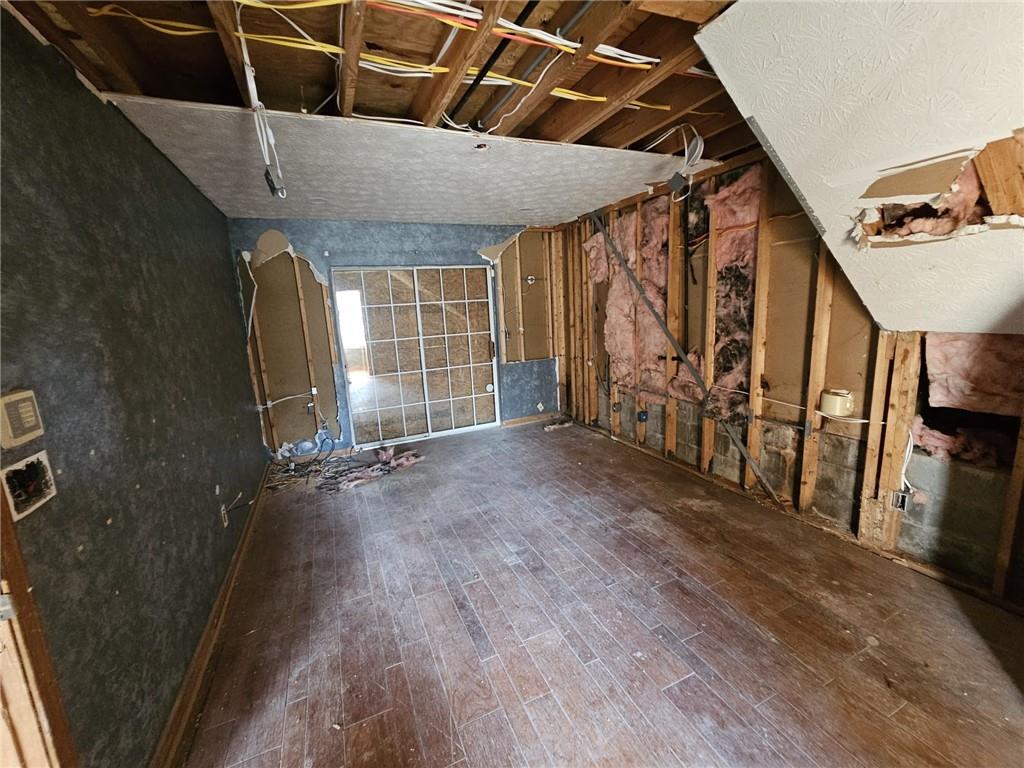3738 Sandy Shoals Lane Decatur, GA 30034 - Photo 13 of 38 a view of an empty room with wooden floor and stairs