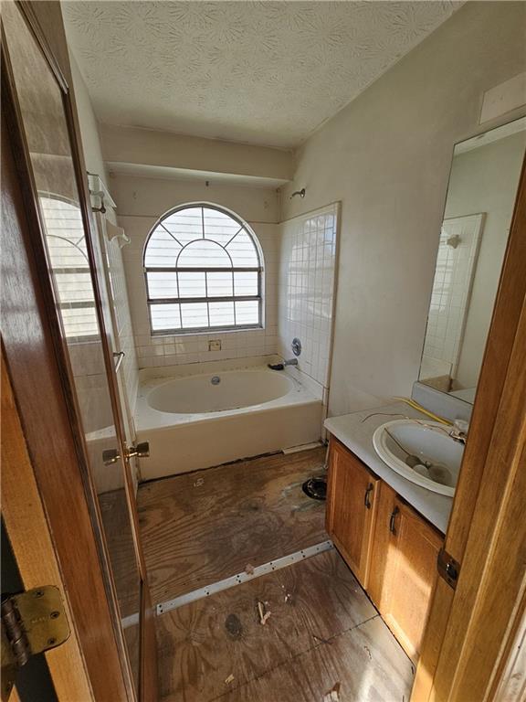 3738 Sandy Shoals Lane Decatur, GA 30034 - Photo 15 of 38 a bathroom with a tub sink and mirror