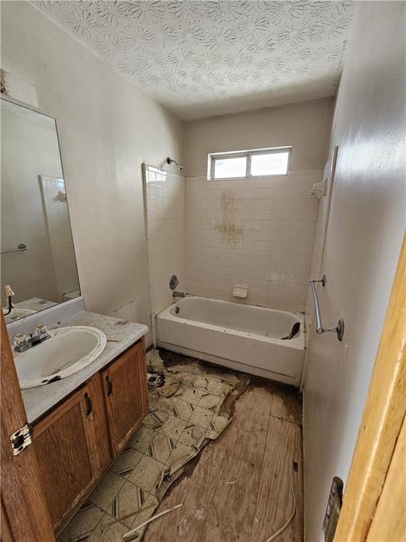 3738 Sandy Shoals Lane Decatur, GA 30034 - Photo 20 of 38 a bathroom with a tub sink and mirror