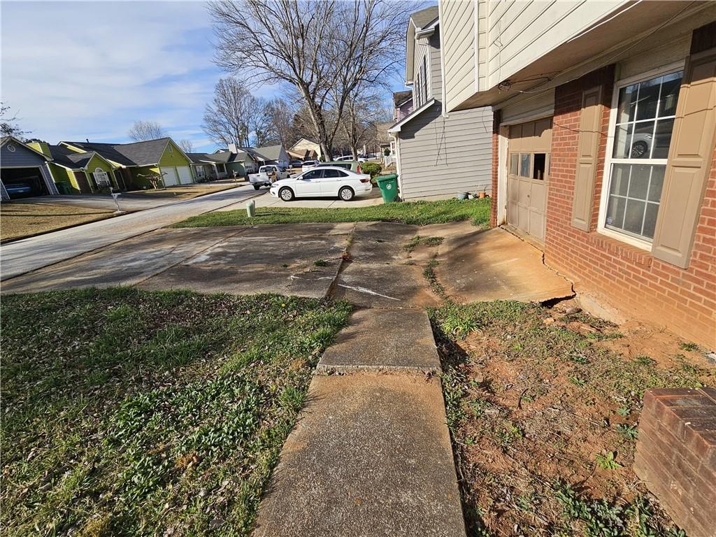 3738 Sandy Shoals Lane Decatur, GA 30034 - Photo 36 of 38 a view of a house with a yard and pathway