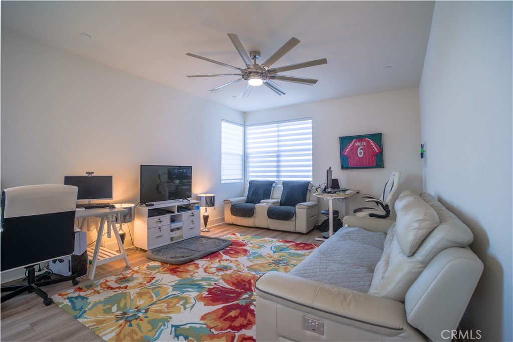 35323 Orchard Trail Fallbrook, CA 92028 - Photo 12 of 32 a living room with furniture a flat screen tv and a window