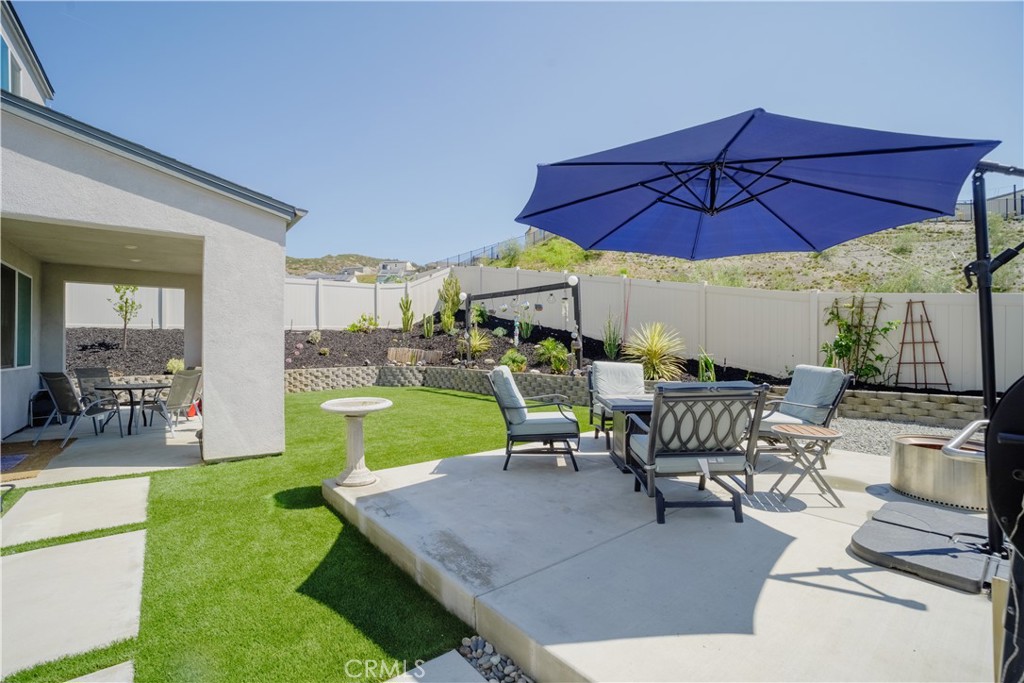 35323 Orchard Trail Fallbrook, CA 92028 - Photo 26 of 32 a view of a backyard with a patio and dining space