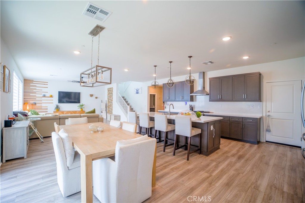 35323 Orchard Trail Fallbrook, CA 92028 - Photo 9 of 32 a large kitchen with a table and chairs