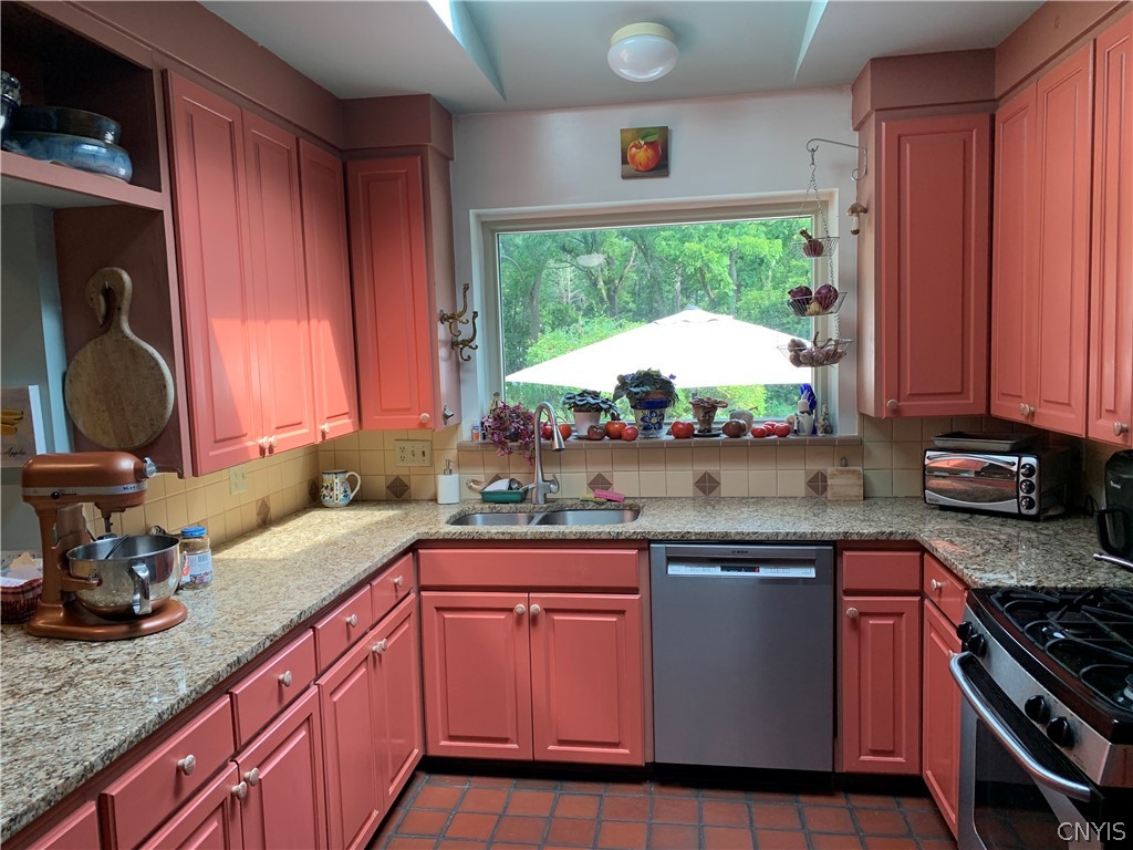 215 Dewitt Road Syracuse, NY 13214 - Photo 11 of 49 Updated kitchen with an oversized window overlooki
