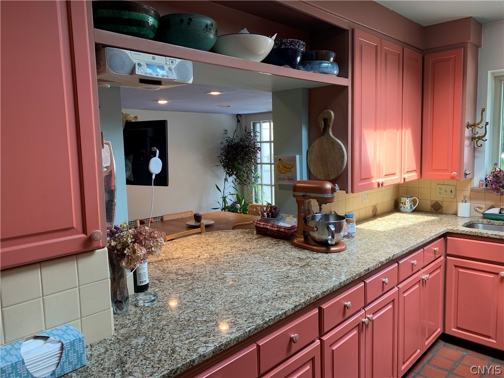 215 Dewitt Road Syracuse, NY 13214 - Photo 12 of 49 The pass-through opens the kitchen to the breakfas