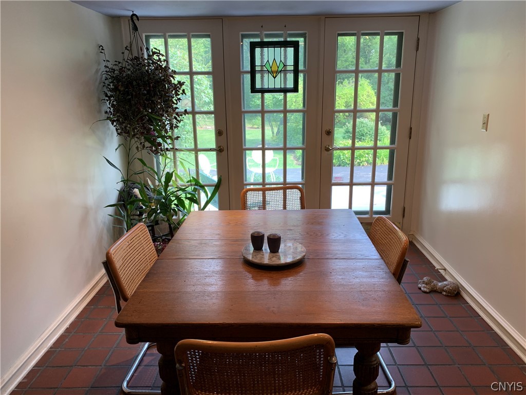 215 Dewitt Road Syracuse, NY 13214 - Photo 14 of 49 The breakfast room has two French doors to the dec