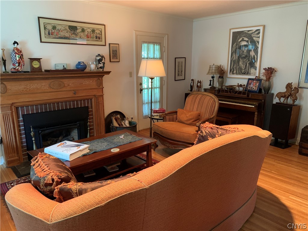 215 Dewitt Road Syracuse, NY 13214 - Photo 18 of 49 The fireplace is the focal point of the living roo