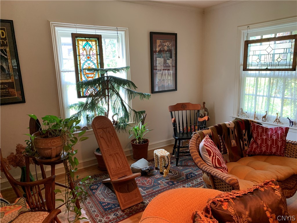 215 Dewitt Road Syracuse, NY 13214 - Photo 20 of 49 Large windows and hardwood floors in the living ro