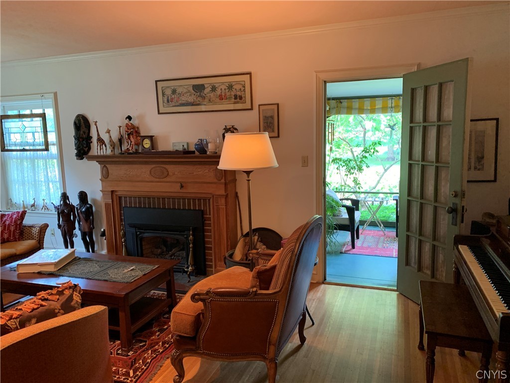 215 Dewitt Road Syracuse, NY 13214 - Photo 21 of 49 A French door leads out to the screened porch from