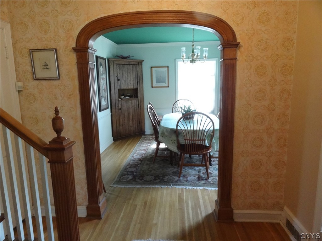 215 Dewitt Road Syracuse, NY 13214 - Photo 5 of 49 The archway leads from the entrance hall into the