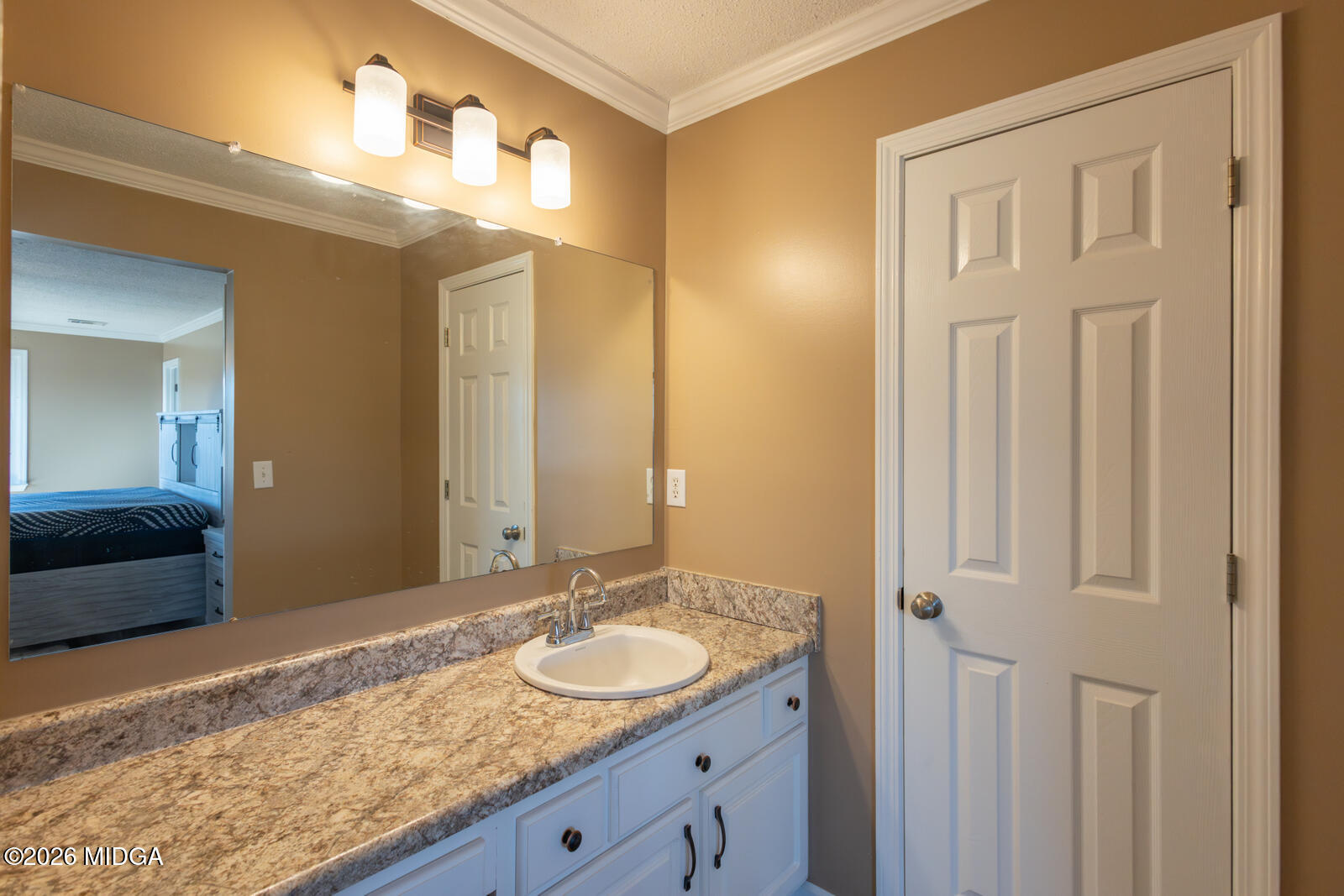 1578 Edsel Senn Road Rockledge, GA 30454 - Photo 12 of 32 a bathroom with a granite countertop sink and a mirror