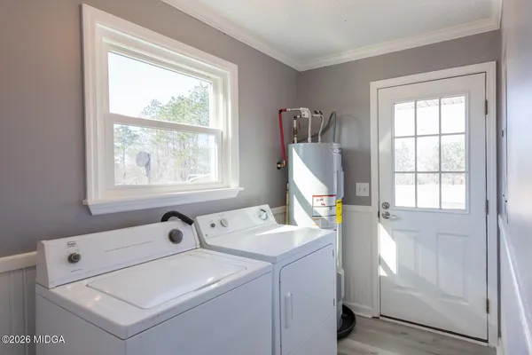 a utility room with dryer and washer