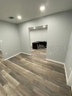 a view of empty room with a fireplace