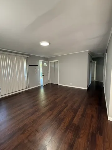 a kitchen with a refrigerator a sink and cabinets