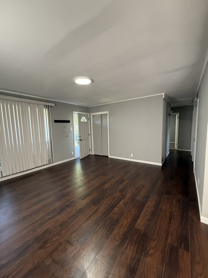 16939 Jodave Avenue Hazel Crest, IL 60429 - Photo 5 of 10 a view of empty room with wooden floor