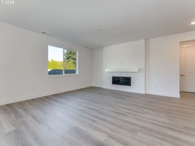 a view of a kitchen with a sink and a microwave