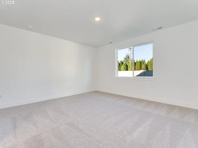 a spacious bathroom with a sink double vanity and mirror