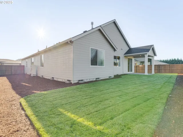 a view of a back yard of the house