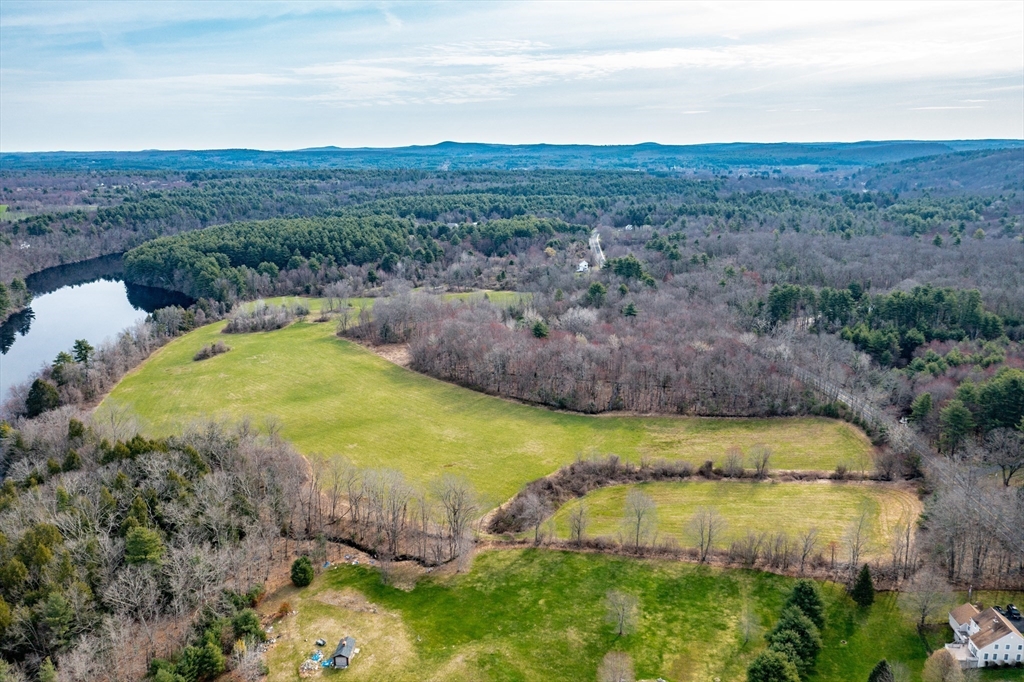 30 Red Bridge Road Wilbraham, MA 01095 - Photo 1 of 9 a view of a swimming pool with a yard and large trees