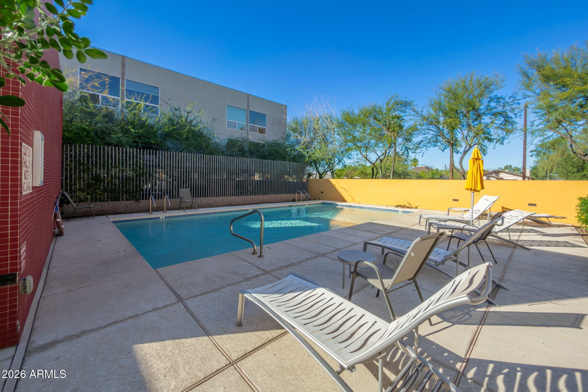 727 East Portland Street, Unit 6 Phoenix, AZ 85006 - Photo 24 of 31 a view of a swimming pool with a patio