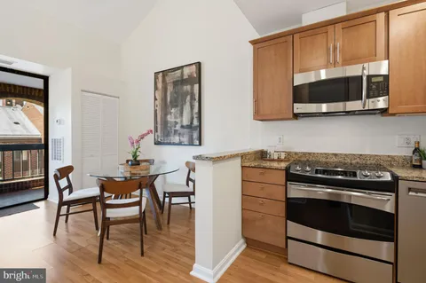 a kitchen with a stove and a microwave