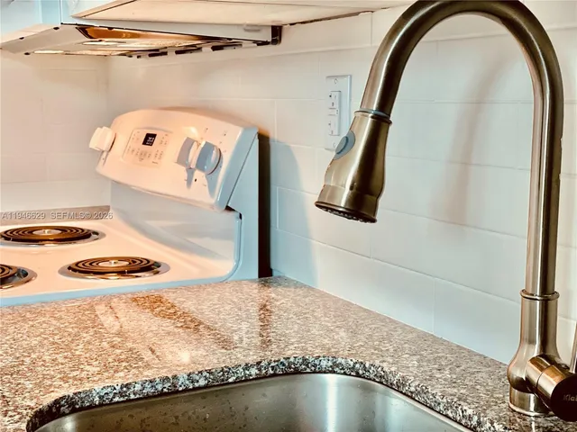 a bathroom with a sink and mirror