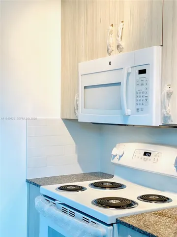 a utility room with washer and dryer