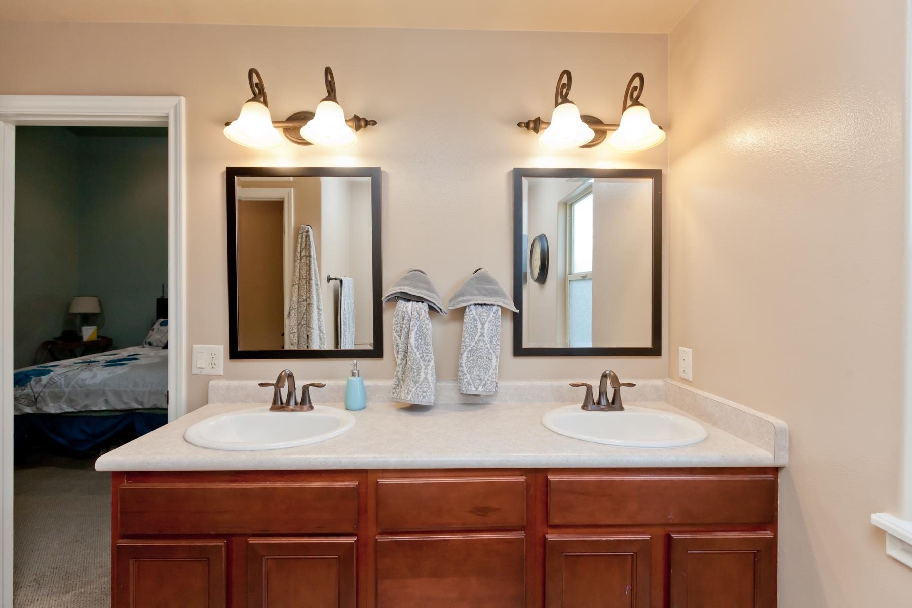 1037 Wingate Drive Fruita, CO 81521 - Photo 13 of 42 a bathroom with double sink and two mirror