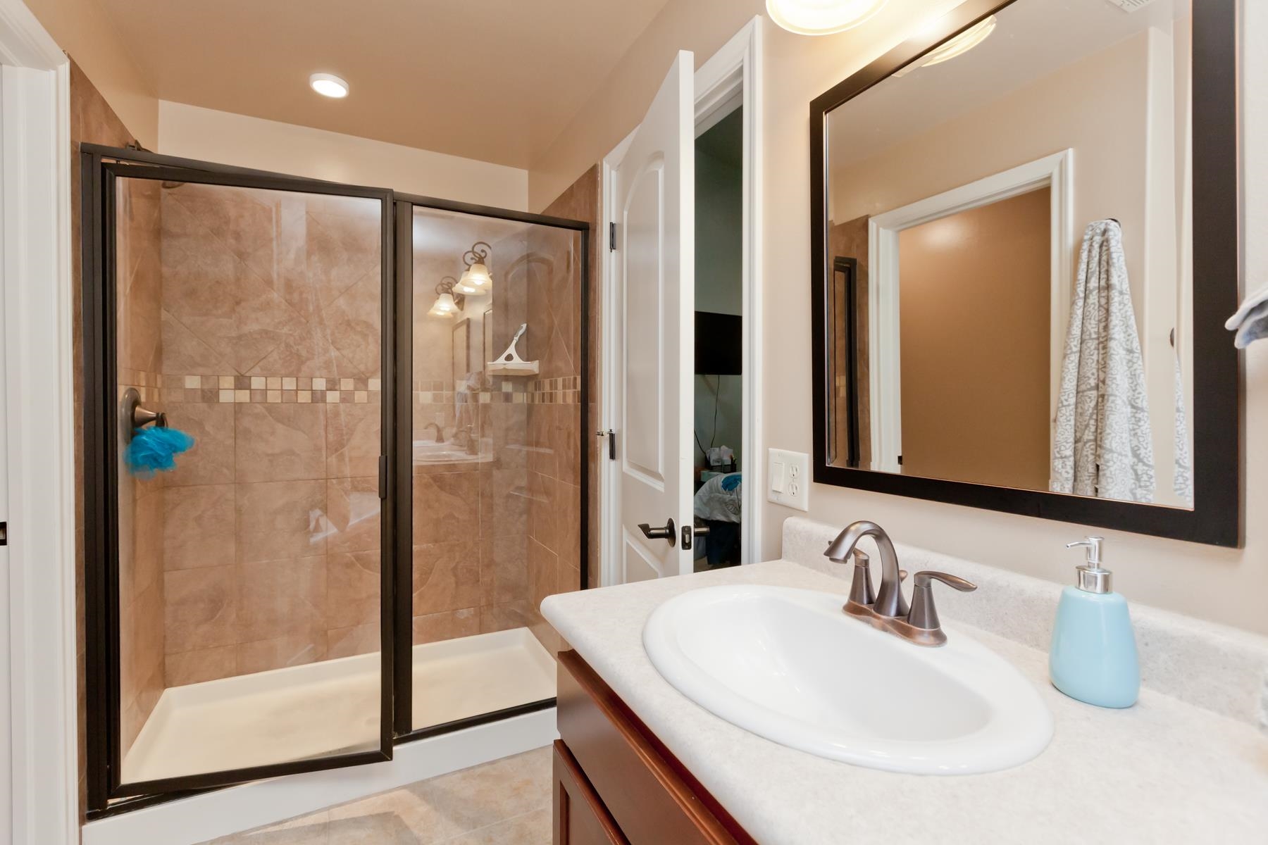 1037 Wingate Drive Fruita, CO 81521 - Photo 15 of 42 a bathroom with double vanity and a mirror