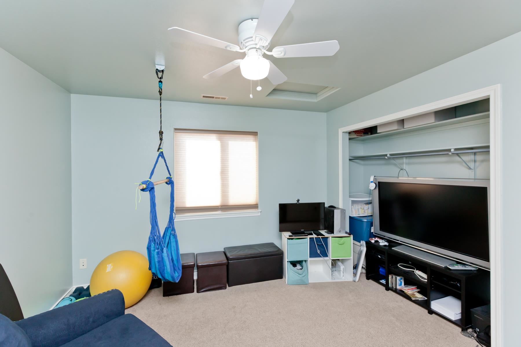 1037 Wingate Drive Fruita, CO 81521 - Photo 16 of 42 a living room with furniture and a flat screen tv