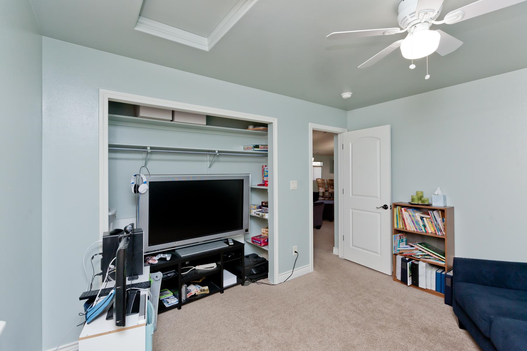 1037 Wingate Drive Fruita, CO 81521 - Photo 17 of 42 a living room with a flat screen tv and a fireplace