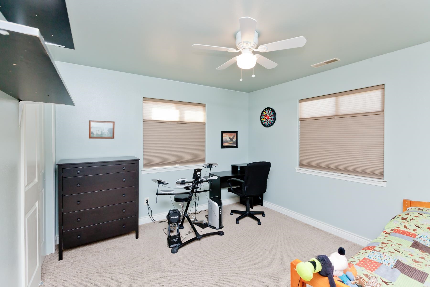 1037 Wingate Drive Fruita, CO 81521 - Photo 21 of 42 a view of a workspace with furniture and a window