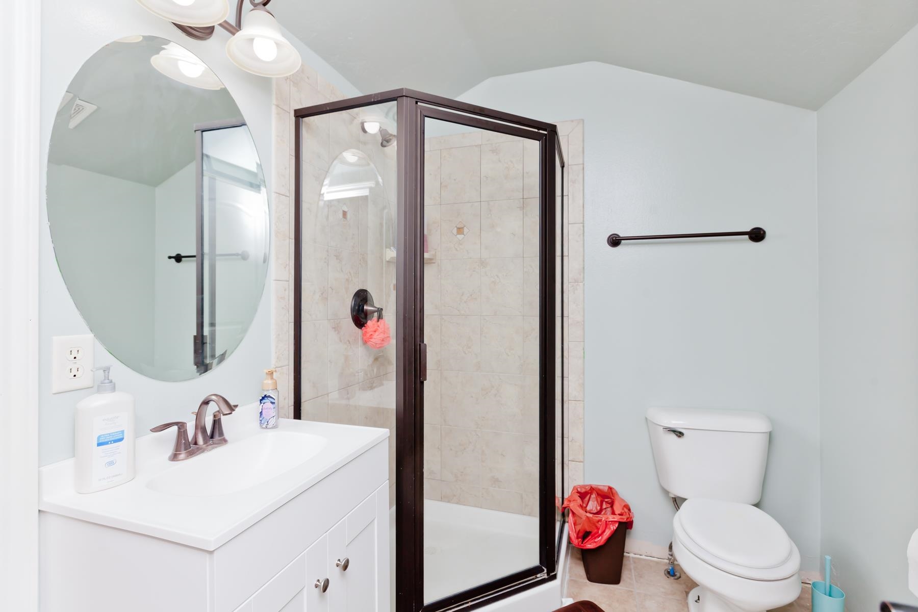 1037 Wingate Drive Fruita, CO 81521 - Photo 31 of 42 a bathroom with a sink vanity mirror and toilet