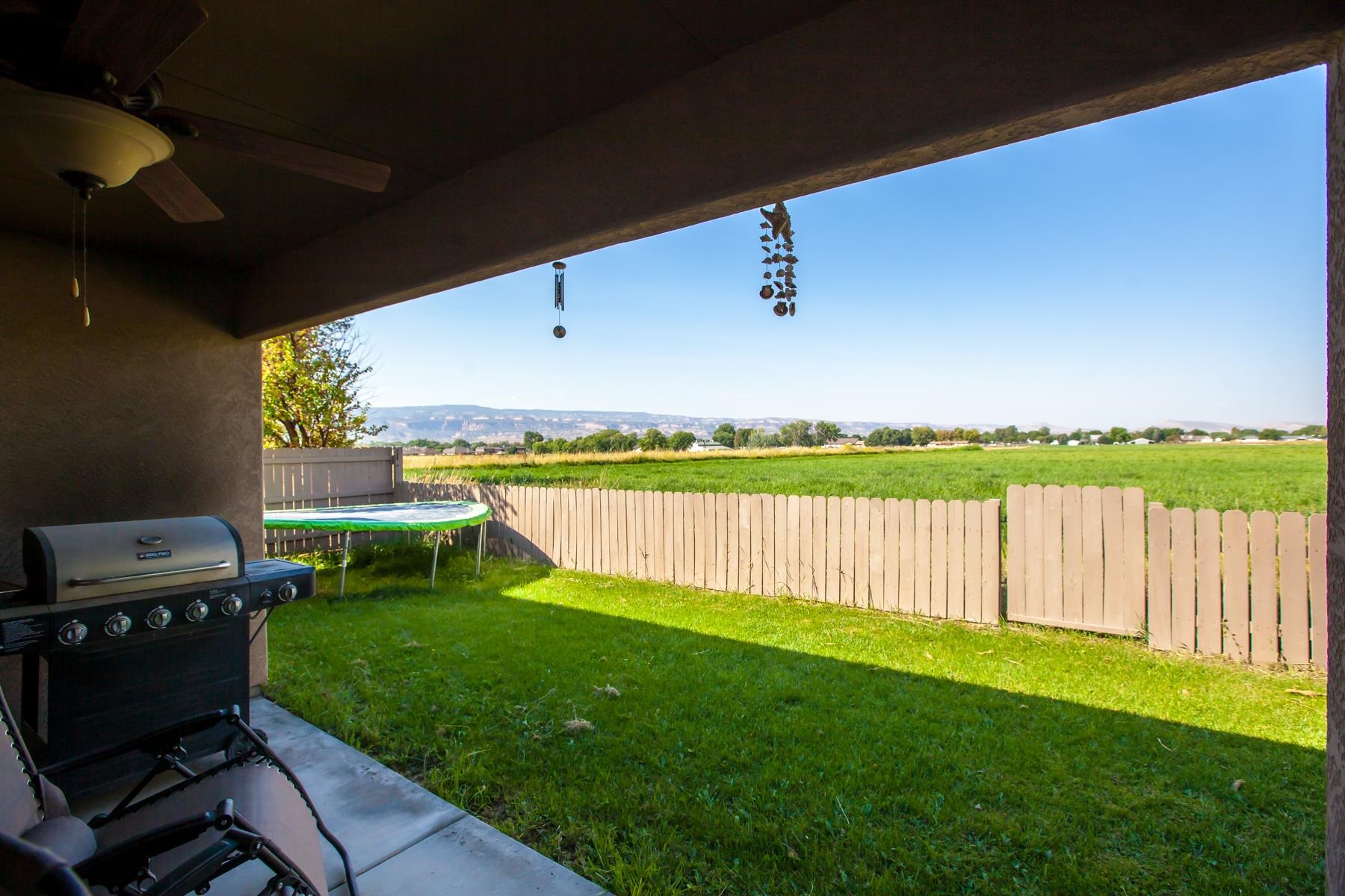 1037 Wingate Drive Fruita, CO 81521 - Photo 33 of 42 a view of a swimming pool with a yard