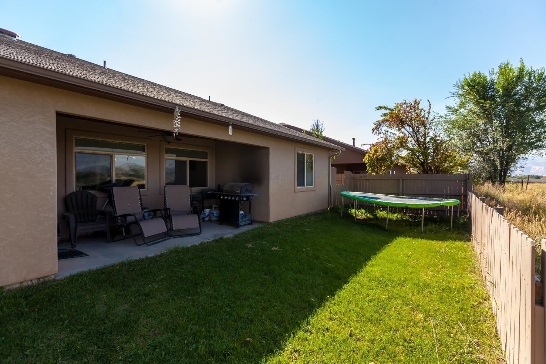 1037 Wingate Drive Fruita, CO 81521 - Photo 36 of 42 a view of a backyard with sitting area
