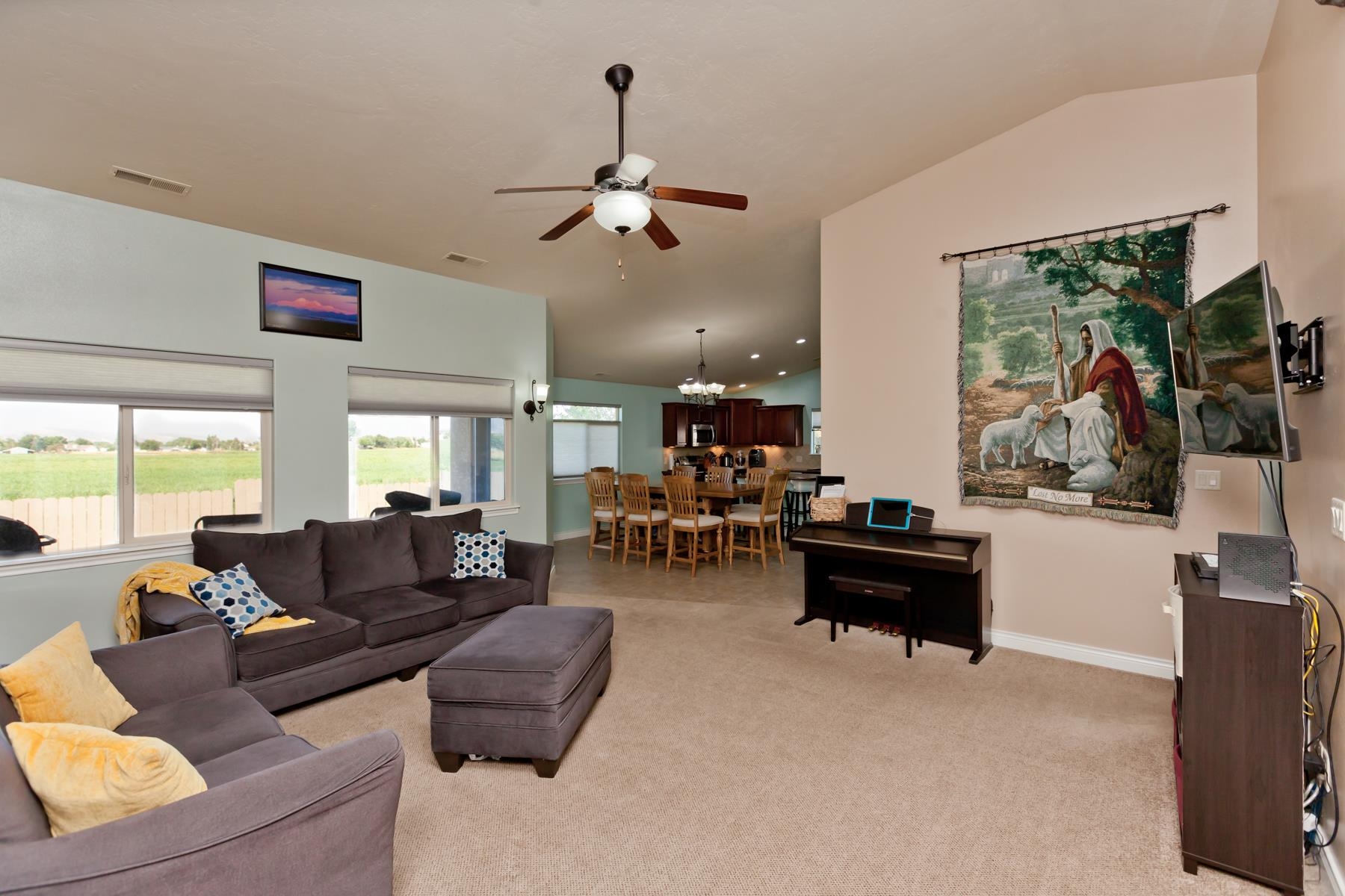 1037 Wingate Drive Fruita, CO 81521 - Photo 4 of 42 a living room with furniture or couch and a large window