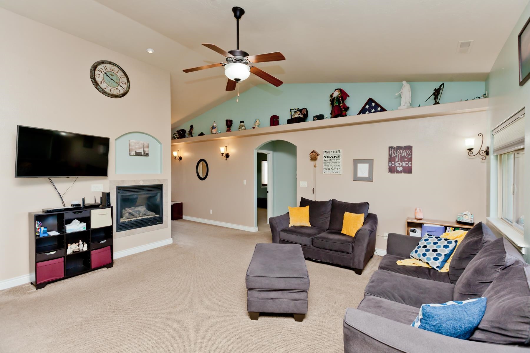1037 Wingate Drive Fruita, CO 81521 - Photo 5 of 42 a living room with furniture and a flat screen tv