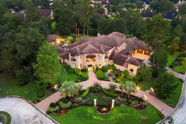 an aerial view of house with yard swimming pool and outdoor seating