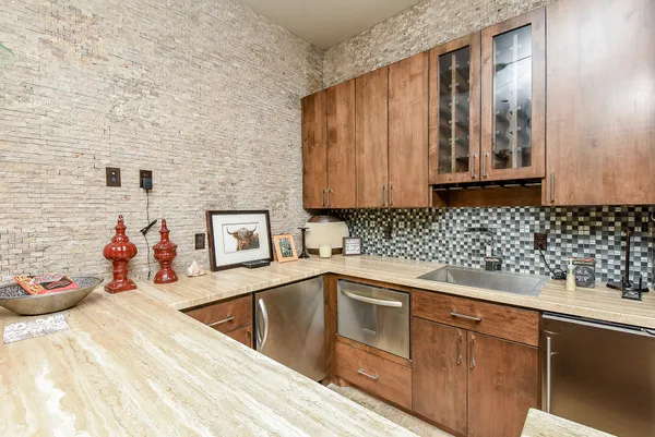 a utility room with sink dryer and washer