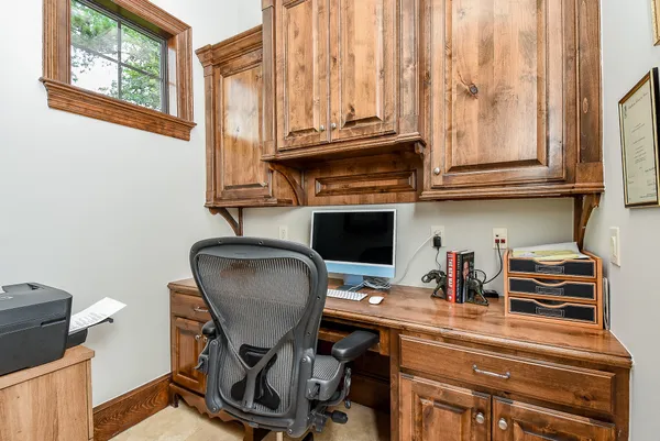 a spacious bedroom with a bed and a dresser