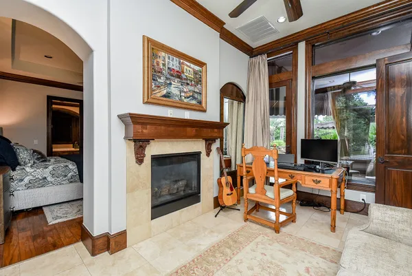 a large bedroom with a bed and a fireplace