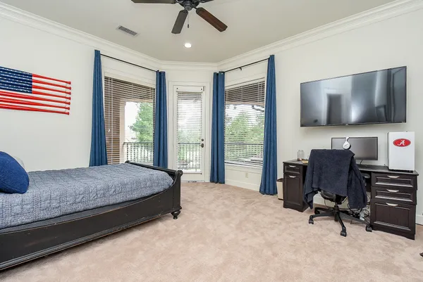 a living room with furniture gym equipment and a window