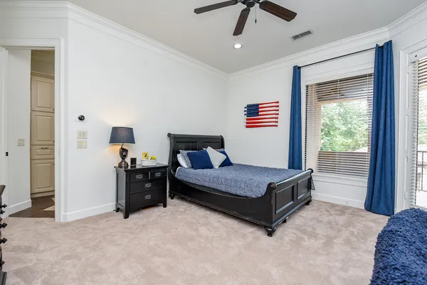 a view of a porch with furniture and floor to ceiling window