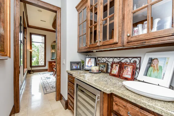 a kitchen with stainless steel appliances granite countertop a sink and a stove
