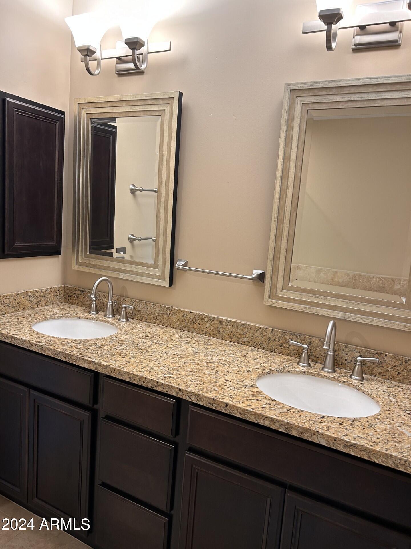 36600 North Cave Creek Road, Unit C20 Cave Creek, AZ 85331 - Photo 13 of 32 a bathroom with a granite countertop sink vanity and a mirror