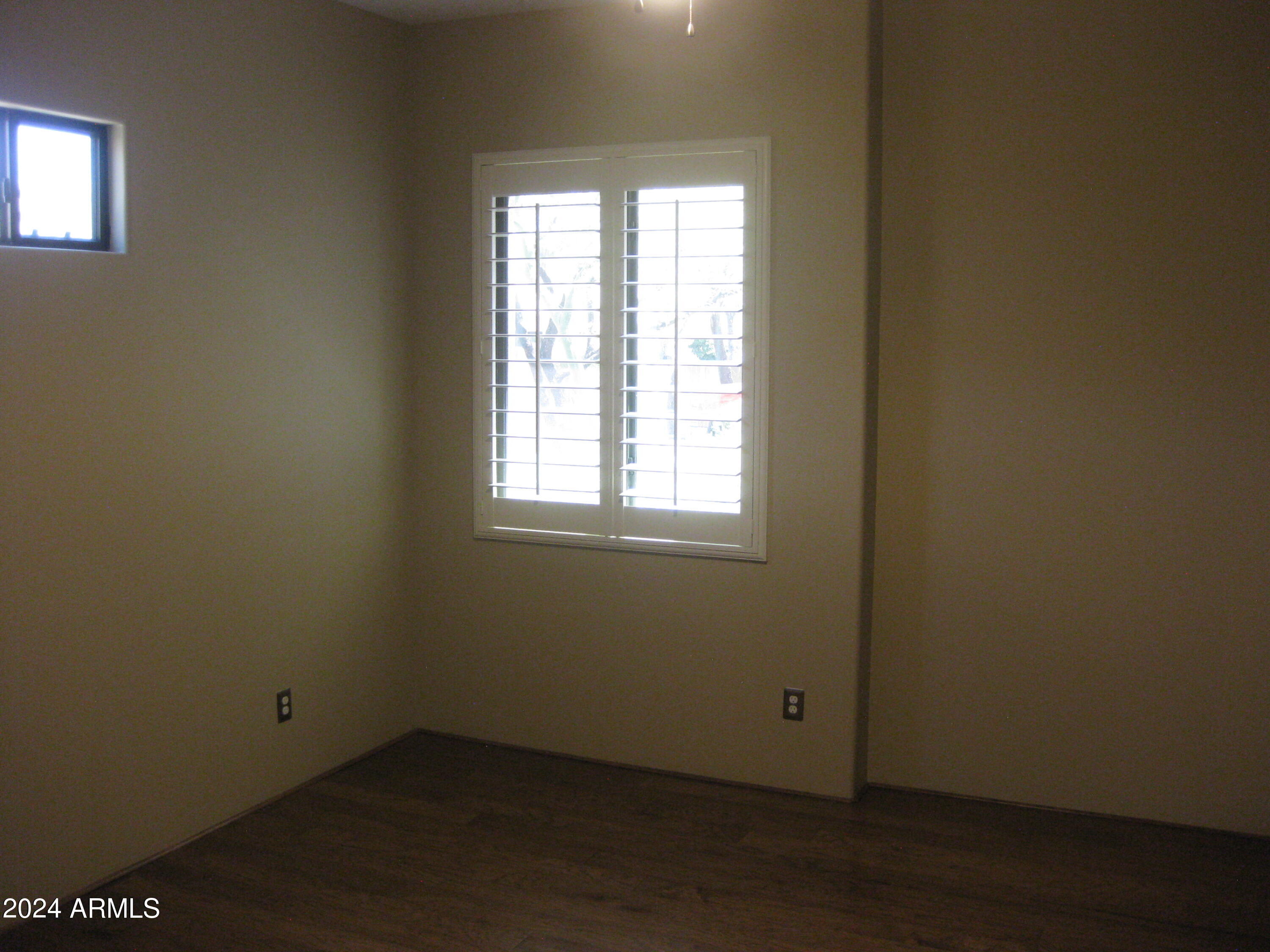 36600 North Cave Creek Road, Unit C20 Cave Creek, AZ 85331 - Photo 17 of 32 wooden floor and window in an empty room