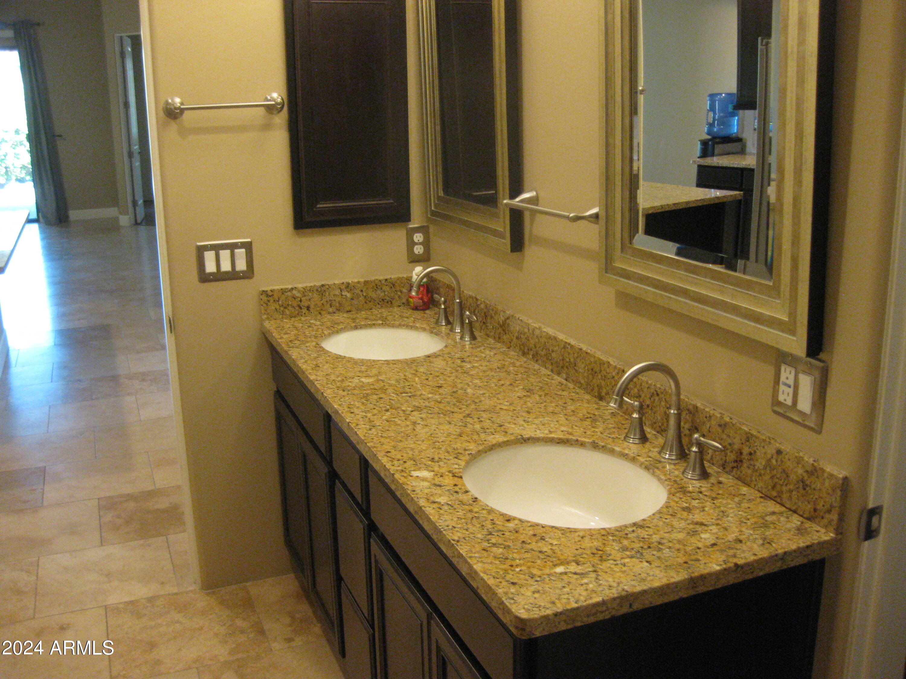 36600 North Cave Creek Road, Unit C20 Cave Creek, AZ 85331 - Photo 19 of 32 a bathroom with a granite countertop sink and a mirror