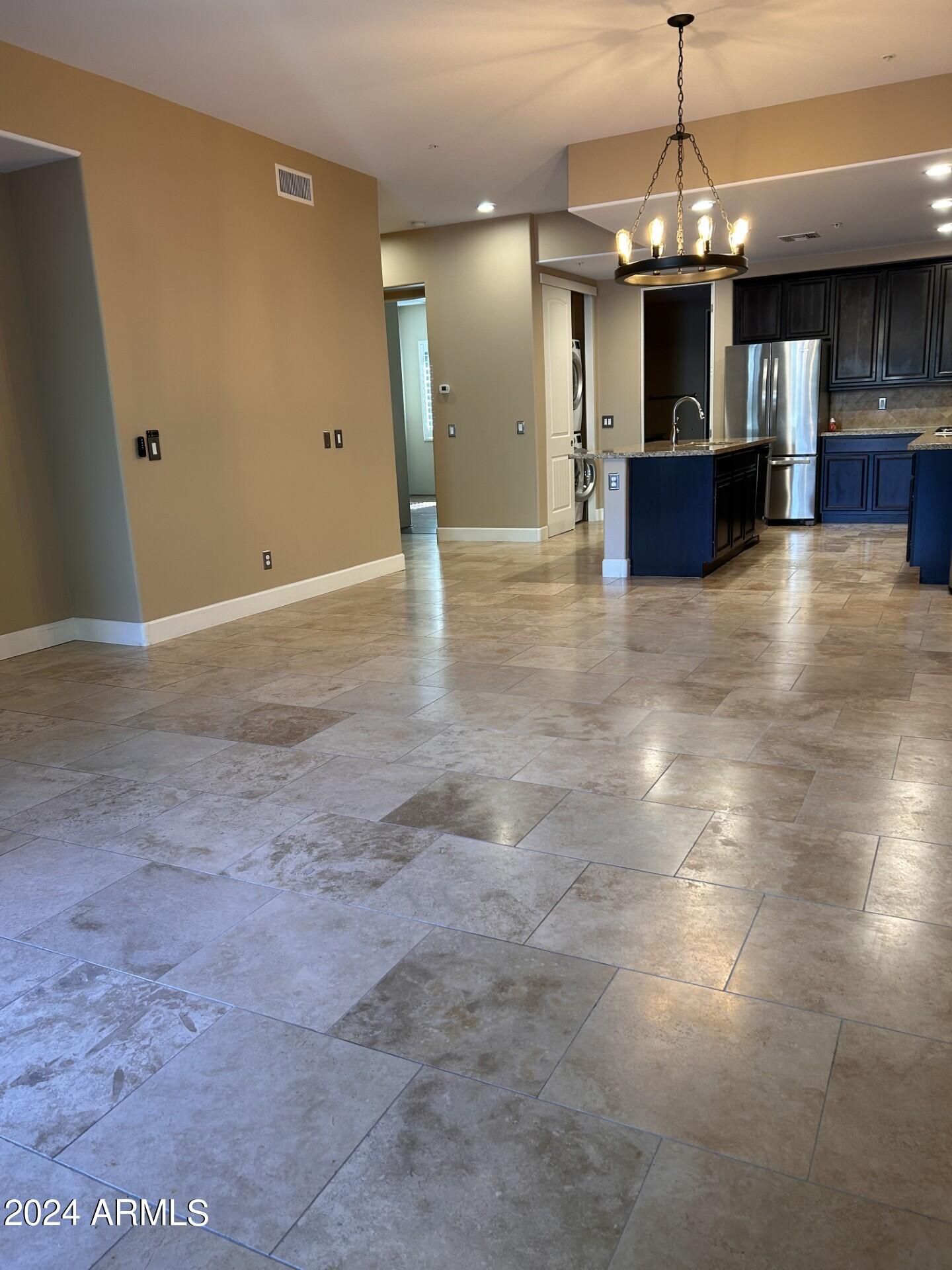 36600 North Cave Creek Road, Unit C20 Cave Creek, AZ 85331 - Photo 8 of 32 a view of a kitchen with a sink and chandelier